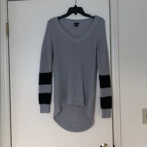 Gray sweater with black striped sleeves